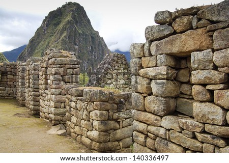 Ancient ruins of Machu Picchu lost city, with Wayna Pichu mountain at the back in Peru, South America