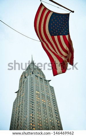 NEW YORK - DECEMBER 1: Chrysler building facade with the american flag in front of it, pictured on December 1, 2009 in New York City, It was the world\'s tallest building for 11 months