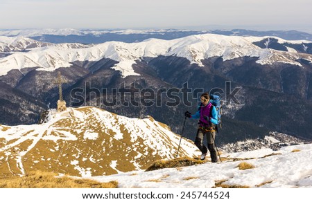 Mountain girl exploring at winter
