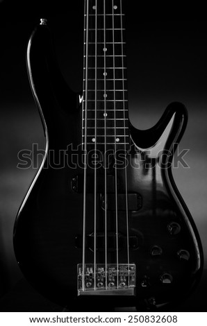 Black bass guitar isolated on black background