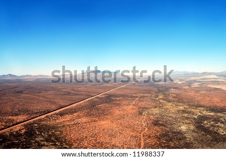 Aerial of the U.S. Mexico border fence in the Arizona desert