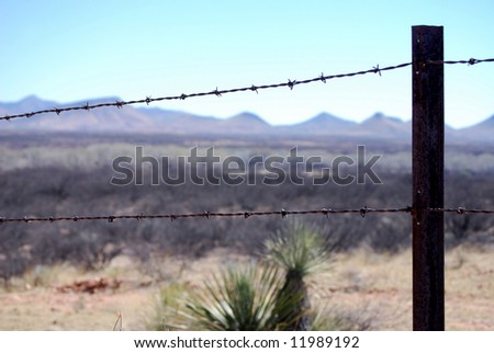 Razor-wire border fence in Arizona to prevent cattle but not people from crossing the border