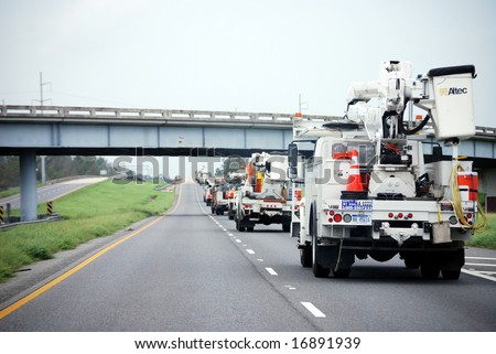 NEW ORLEANS - SEPT 2: A convoy of repair vehicles move along the I-10 freeway towards Baton Rouge in the aftermath of Hurricane Gustav on September 2, 2008 near New Orleans.