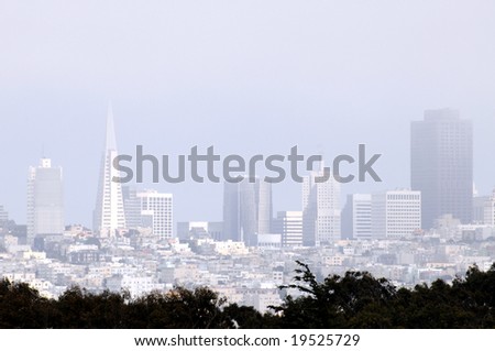 Downtown San Francisco covered in fog, a view from the Golden Gate Bridge