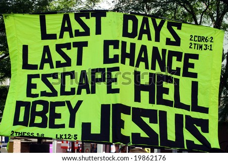 stock photo : Poster urging people to believe in Jesus and warning about the end of time, held up during a demonstration