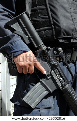 Closeup of M4 carbine / assault rifle held by a special forces soldier on the Mexican side of the US-Mexico border