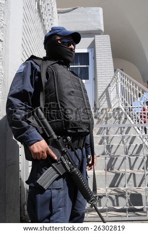 Fully armed and protected special forces soldier on the Mexican side of the US-Mexico border