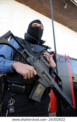 CIUDAD JUAREZ, MEXICO - FEB 27: A masked and armed special forces soldier stands ready to face drug cartels on February 27, 2009, in the violence-ridden border city of Ciudad Juarez, Mexico.