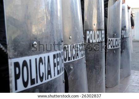 Shields of Mexican federal police forces maintaining order in the violent border city of Ciudad Juarez