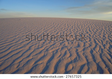 White gypsum dunes just before sunset in the desert at the White Sands National Monument in New Mexico