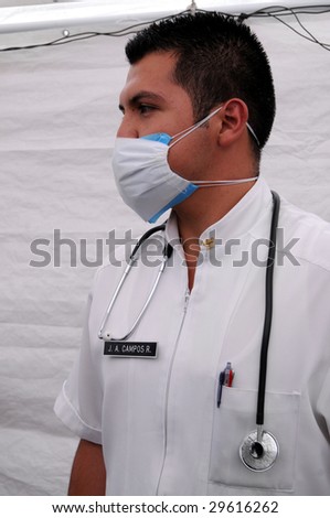 MEXICO CITY - APRIL 29: Close up of doctor J.A. Campos at a makeshift tent clinic in downtown Mexico City, treating patients suspected of H1N1 swine flu influenza on April 29, 2009 in Mexico City.