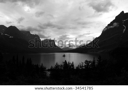 A black and white photo of the Wild Goose Island and Saint Mary Lake in the Glacier National Park in Montana, northwestern USA, shot in early July.