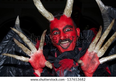 CORK, IRELAND - OCTOBER 31 - An unidentified man dressed up in a devil costume in a Halloween parade October 31, 2012, Cork, Ireland.
