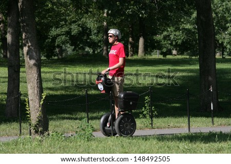 Washington, Dc - July 29: A Tour Guide Operates A Segway During A Segway Tour Along The National Mall On July 29, 2013 In Washington.