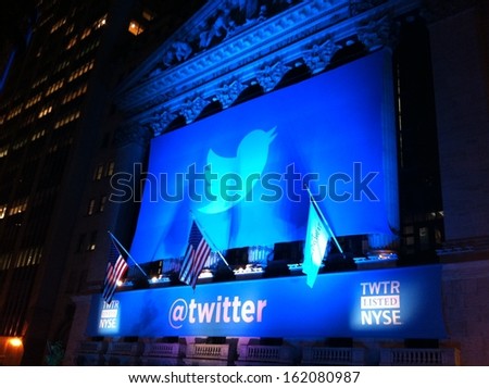 New York - November 7: The Twitter Logo Is Shown In Front Of The Nyse On Evening Of Its Ipo On November 7, 2013 In New York. Twitter, Ticker Symbol: Twtr, Went Public Today At $26 Per Share.