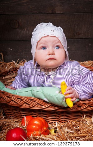 funny lovely baby girl little child in trendy dress on hay. happy kid playing game. Cute adorable child baby American girl. Beautiful expressive laughing smiling baby infant toddler