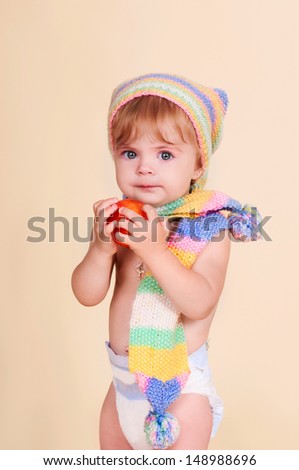 funny lovely baby girl little child in trendy in a knitted suit. happy kid playing game. Cute adorable child baby American girl. Beautiful expressive laughing smiling baby infant toddler