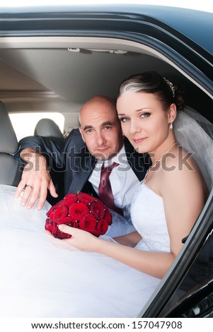 Happy bride and groom on wedding. newlywed couple at wedding day outdoors in the wedding car. man and woman at honeymoon. marriage. Loving couple embracing. Bride and groom on nature. Marriage. series
