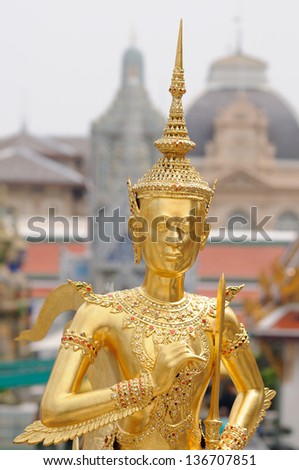 BANGKOK - MARCH 08: A Golden Kinnara Statue at Wat Phra Kaew (the Temple of the Emerald Buddha) on March 08, 2013 in Bangkok, Thailand.