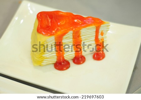 A Piece of Crepe Cake with Orange Sauce (focus on the crepe)