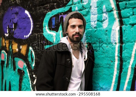 Portrait of young latin man. Urban scene.
