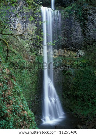 Double falls tumbles down a cliff in Silver Falls State Park Oregon USA