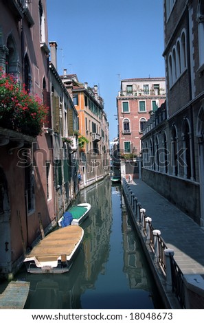 Quiet back street canal scene of Cannaregio Venice Italy