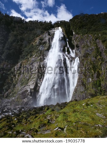 Bowen Falls 160 meter high waterfall in Milford Sound Fiordland National Park South Island New Zealand