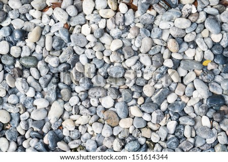 Abstract background of round grey pebble stones