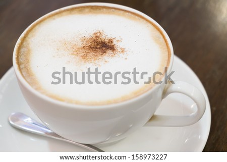 Cup of cappuccino in white cup