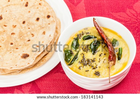 Indian Dal Fry and Chapati - Homemade chapati (Indian bread) served with Indian Dal fry. It is prepared using dal (pigeon pea).