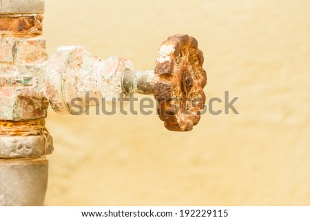 Rusty Gate Valve - Closeup view of a gate valve that is covered with rust.