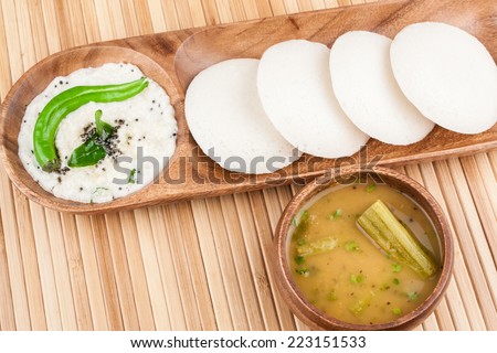 Idly with Chutney Sambar - A traditional ethnic south Indian breakfast of Idly (Idli / rice cake) served with coconut chutney and sambar.