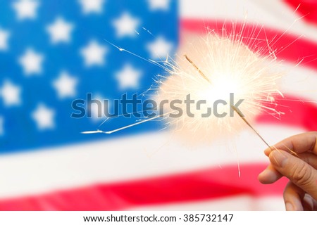 4 of july concept with sparkler and usa flag