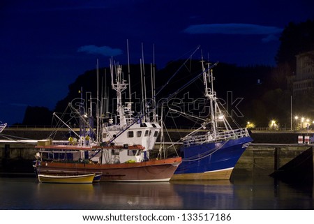 Fishing boats in port at night. Fishing boats at night in Ondarroa Port, Guipuzcoa, Basque Country, North Spain.