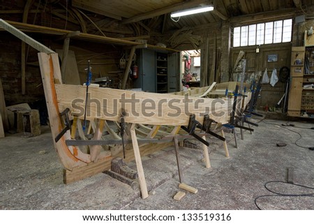 Wooden boat under construction. Small wooden boat under construction in traditional shipyard. Cantabric Sea,  Spain.