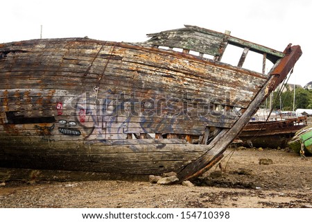 Abandoned old wooden boat prow detail. hull of an old wooden fishing boat stranded. Old boat prow.
