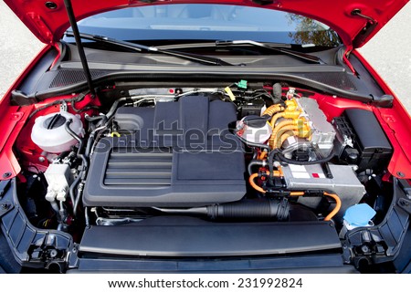 Frontal view of the two engines of a modern hybrid car.  Hybrid car engine.