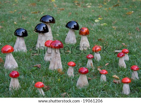 garden decor - group of wooden mushrooms in grass