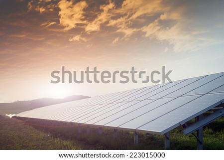 solar battery field against sunset