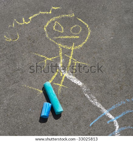 Child\'s sidewalk chalk drawing of a person, including colored chalk scattered about.