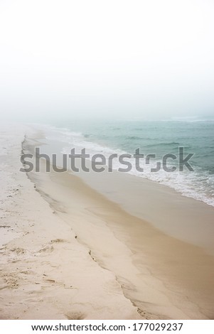 Soft pastel landscape photo of waves breaking on a pristine, peaceful, unpopulated beach. pastel landscape photo of waves breaking on a pristine, peaceful, unpopulated beach.