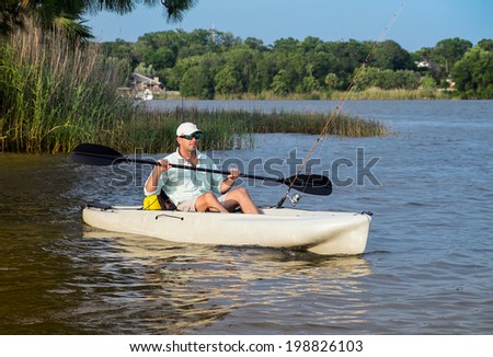 Man kayak fishing