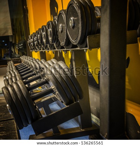 A rack of dumbbells weights