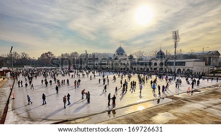 Budapest, Hungary - December 31: City Park Ice Rink On December 31, 2013 In Budapest, Hungary. City Park Is Europe'S Largest Outdoor Ice Skating Rink In The Winter And A Lake For Boating In The Summer