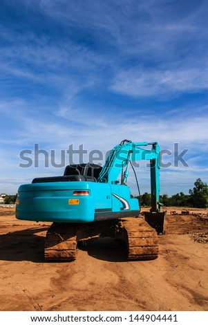Modern blue excavator machines with blue background