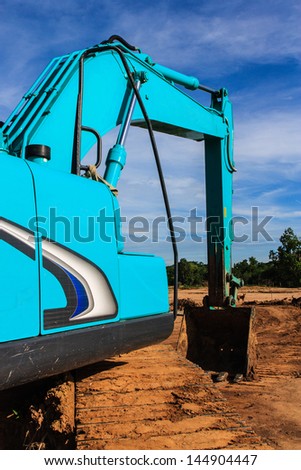 Modern blue excavator machines with blue background