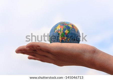 The Earth on hand with blur background