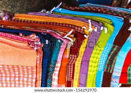 Stack of Thai colorful clothes for sale