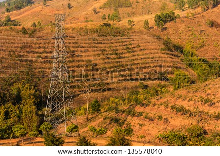 High voltage towers on mountain in rural of Thailand